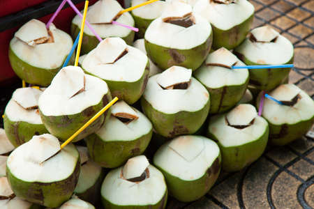 number of coconut stacked on the floor. Popular coconut water.の写真素材