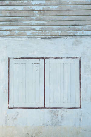 Old windows old wood windows. Old house paint peeling of the walls and windows.の写真素材