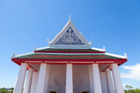 Large white temple. Many of the pillars. Behind the bright blue sky.の写真素材