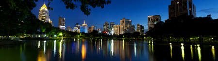 panorama bangkok city at night.Building a pond in front of the park.の写真素材