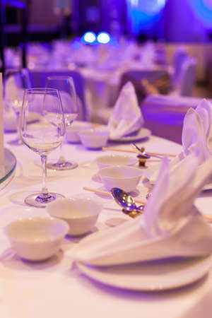 Dining table, glasses, plates and napkins. Decorate the place.のeditorial素材