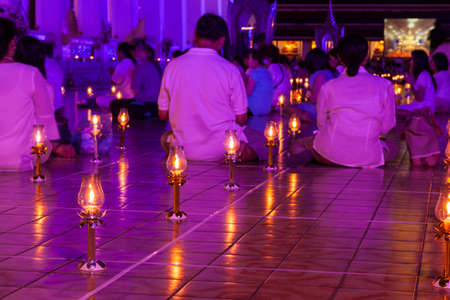 People joined religious rituals. Lamp placed on the floor. People pray.の写真素材