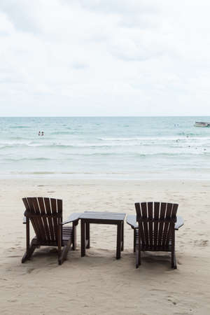 Chairs and table Located on the sandy beachの写真素材