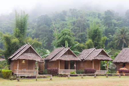 Huts near the mountain There are trees around To tropical and refreshingの写真素材