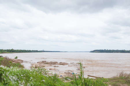 Large Mekong River rocks in the river. Two rivers Thailand and Laos.の写真素材