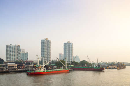 Large marina Near tall buildings Within Bangkok city
