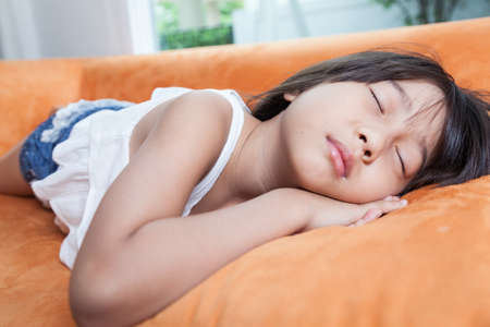 Girl was sleeping.child Asian women with long hair.の写真素材
