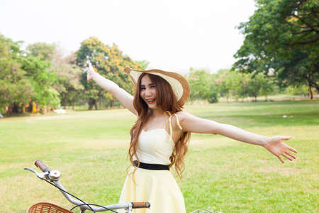 Public feeling refreshed and relaxed in the park. Woman relaxing in the park.の写真素材