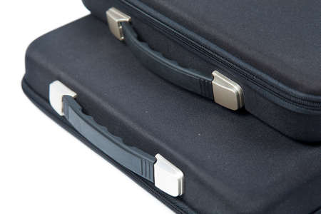 Black briefcase overlapping on white isolated background. and packshot white isolated studio.の写真素材