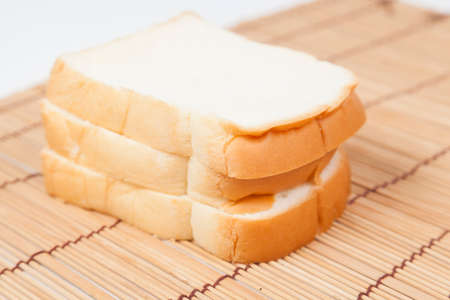 Sliced â€‹â€‹bread on the wooden plate.pack-shot bread in studio.