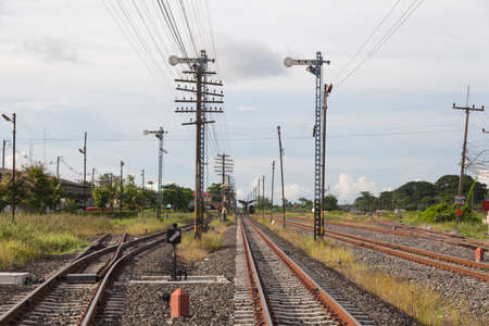 Railway and telegraph poles Telegraph poles installed near the railroad tracks.の写真素材