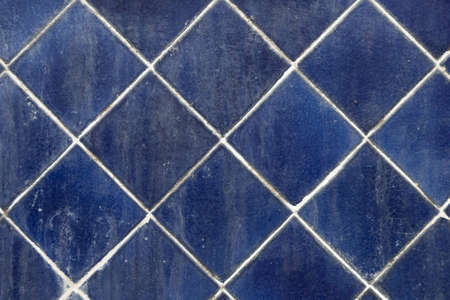 Blue square tiles. Formation on the wall.water and dirt stain.の写真素材