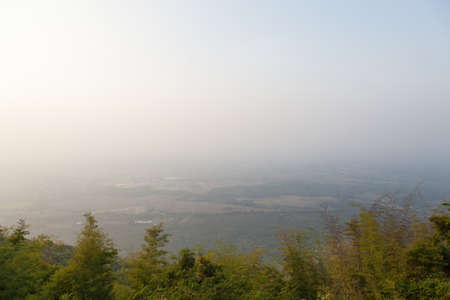 Agricultural area at the foot of the mountain below. Areas of fog in the morning.の写真素材