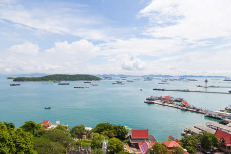 Cargo ships in the sea Waiting to dock. Mostly clear skies.の写真素材