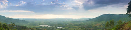 panorama mountains, forests and agricultural areas.Clouds covered the sky in the evening.の写真素材