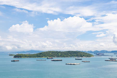 Cargo ships in the sea Waiting to dock. Mostly clear skies.の写真素材