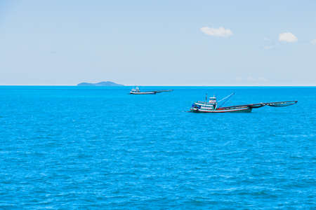 Fishing boat sailing at sea. So go out fishing for deep-sea fishing.の写真素材