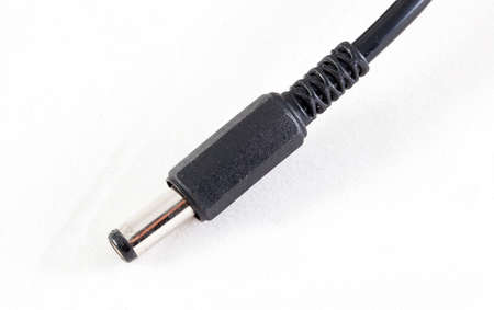 Electrical plug connected devices on a white background. Plug connection between the device and the...