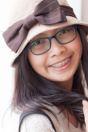clouse up face asia woman.joy and smile woman wear hat and eyeglasses.の写真素材