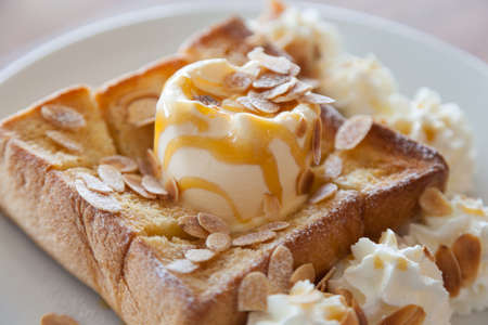 Ice Cream Bread Sweet.bean and cream in dish on table in cafe.の写真素材