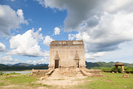 old temple. Leaving the old building was flooded and left abandoned. Clouds covered the skyの写真素材