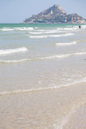 Ocean waves lapped up the beach. Crystal clear water with a little wave on a clear day.の写真素材