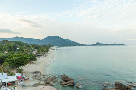 Samui beach The island has an area of mountains in the background. During the evening skyの写真素材