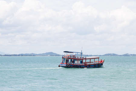 Small Boat crossing The cruise passengers between the coast and the islands.の写真素材