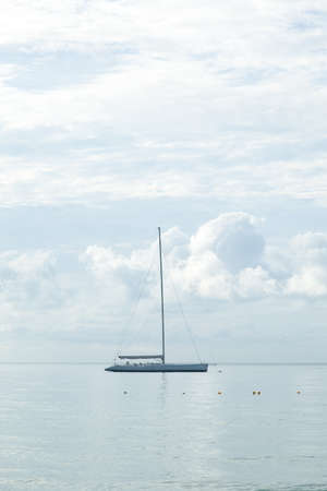 Sailboat moored in the sea Sailboats moored close to the sea coast.の写真素材