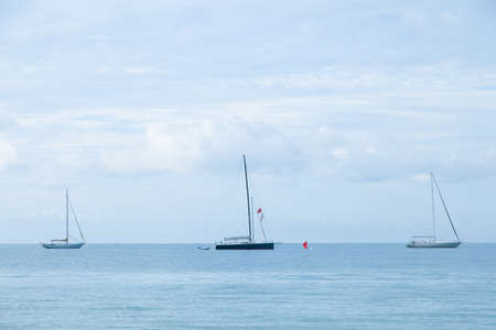 Sailboat moored in the sea Sailboats moored close to the sea coast.の写真素材