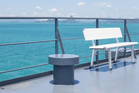 Bench on forecastle White benches located on forecastle. Which was sailing in the seaの写真素材