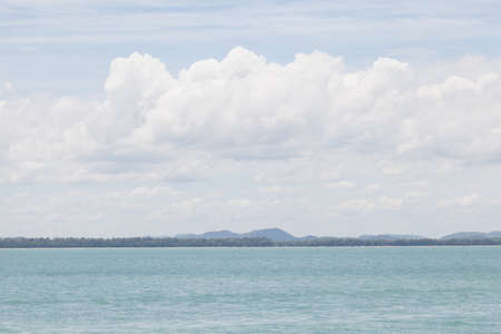 Sea and sky, clouds covered the sky and the sea calm.の写真素材