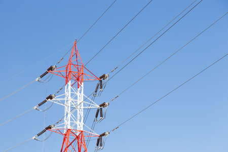 High voltage power pole. High voltage transmission towers from the power plant.の写真素材