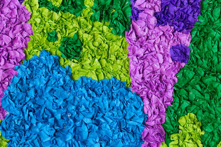 Background of multi-colored paper Color paper stack multiple layers of multiple colors.