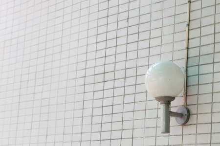 Lamp mounted on the wall. Lamp white sphere mounted on the wall.の写真素材