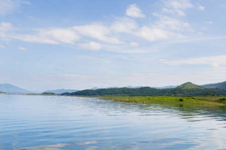 Water in the dam and the mountain Dam water reservoir in the mountains in the background.の写真素材