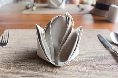 Napkins on the table. The device table fork and knife on the table.の写真素材