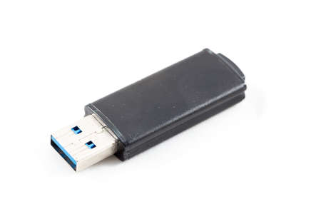Flash Drive on the white background. The flash black on a white background in the photo studio.の写真素材