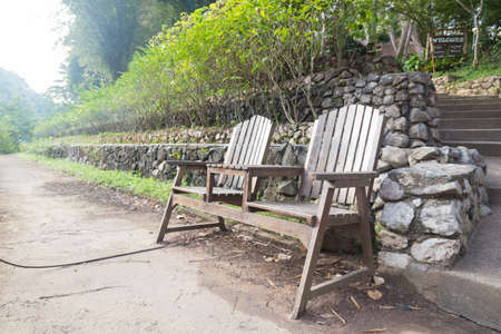 Chairs, garden benches Located on the lawn along the walk in the park.の写真素材