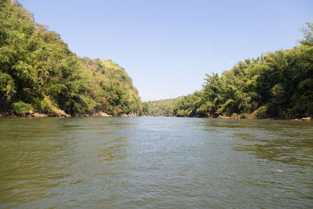 river that flows down from the mountains. The forest trees riverの写真素材