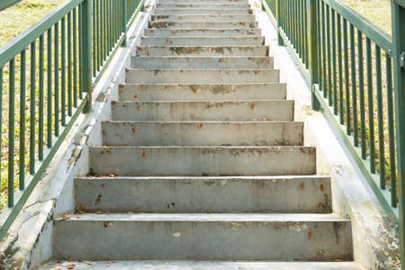 Walk up the stairs. The top end of the corridor is the light.の写真素材