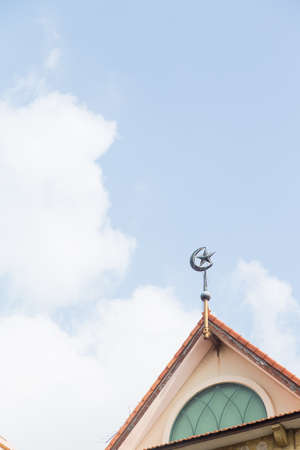 Symbol of Islam. On the roof at the rear of the sky and clouds in the afternoon.の写真素材
