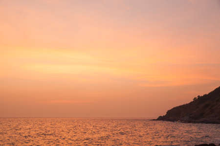 sunset in the evening. Orange sky at dusk in the sea.の写真素材