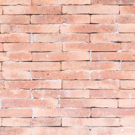 Brown brick wall. The brown brick wall tiles using cement.の写真素材