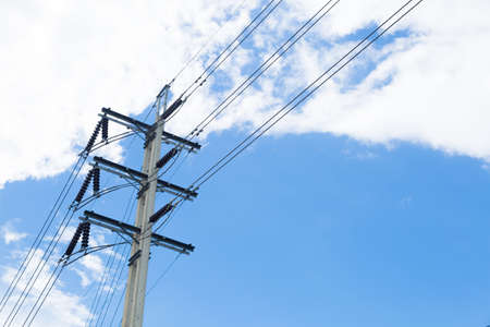 Power poles with wires connected later. Behind the sky