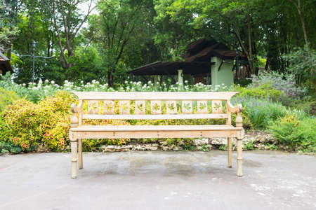 Bench in the park Benches along the pathway in the garden for relaxation.の写真素材