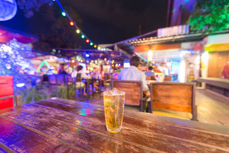 Glass of beer on the table. In the restaurant the night for celebration.の写真素材