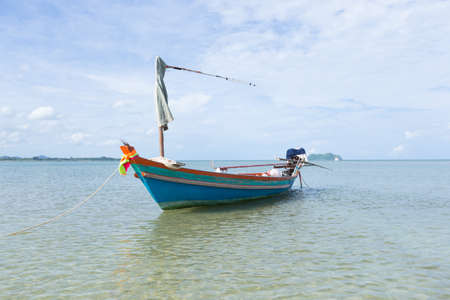 Small fishing boats. Parking on the sea beach. In the daytime skyの写真素材