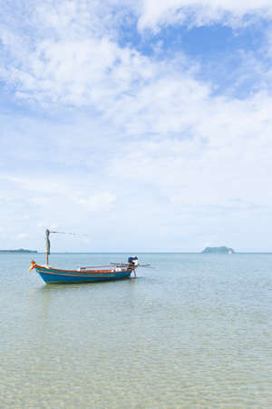 Small fishing boats. Parking on the sea beach. In the daytime skyの写真素材