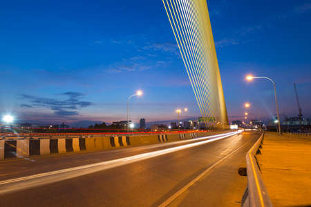 lights of the car that ran on the bridge during the evening.の写真素材